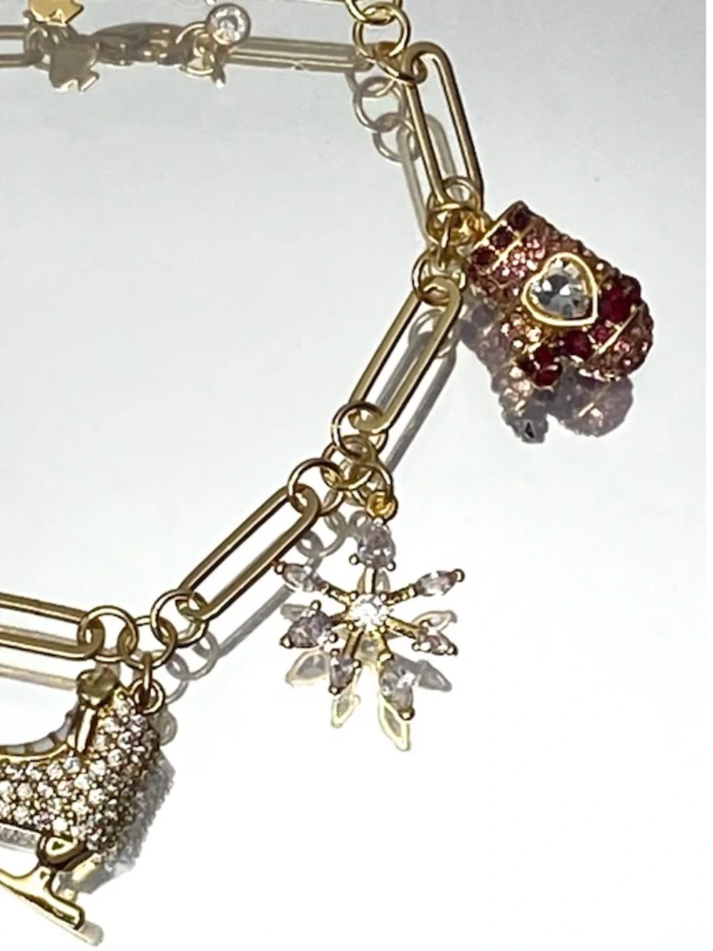kate spade Gold-Tone Ice Skate & Snowflake Charm Bracelet with Pink Accents - Picture 7 of 9